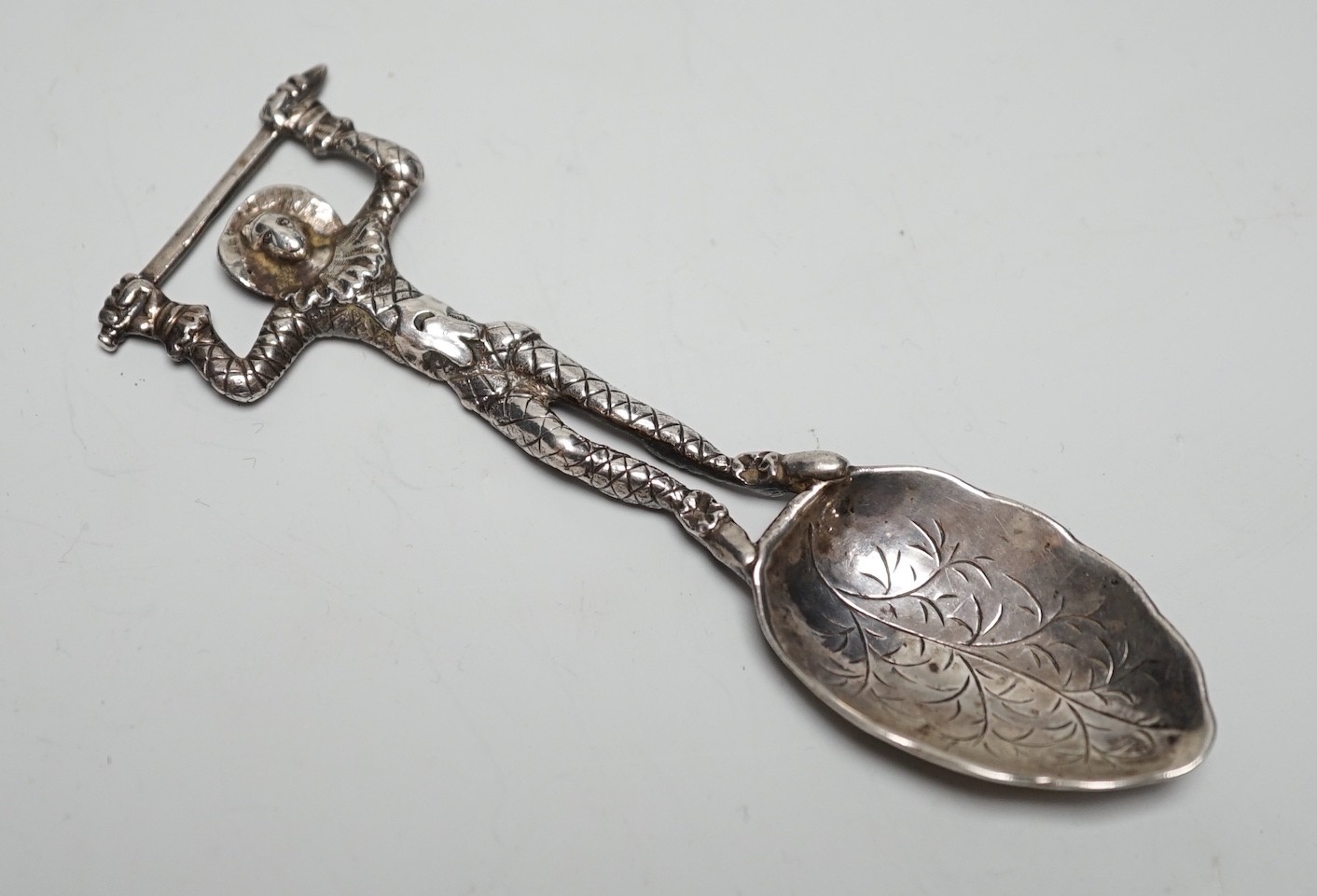 An early Victorian novelty silver caddy? spoon, with figural stem, Susanna Cook, London, 1845, 11.6cm.